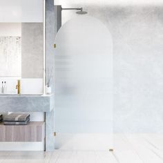 a bathroom with marble walls and white floors