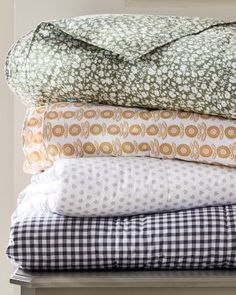 a stack of pillows sitting on top of each other