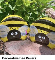 two painted rocks with bees on them