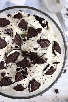 an oreo cookie and cream dessert in a glass bowl on top of a table