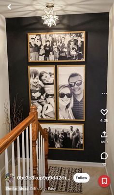 a staircase with pictures on the wall