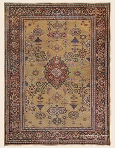 an antique rug with many different colors and designs