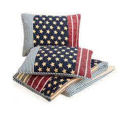 three pillows with stars and stripes on them