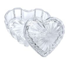 two glass heart shaped dishes on a white background