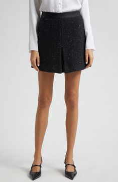 Metallic threads add sparkle and shine to this wool-blend tweed miniskirt perfected with crisp pleats and an A-line silhouette. Hidden side-zip closure Decorative flap pockets Lined 36% virgin wool, 35% polyester, 28% polyamide, 1% acrylic with 100% polyester contrast Dry clean Imported Formal Tweed Mini Skirt, Elegant Tweed Mini Skirt With Lining, Elegant Tweed Lined Mini Skirt, Elegant Tweed Pleated Skirt, Elegant Mini Tweed Dress, Party Tweed Mini Skirt, Elegant Tweed Mini Bottoms, Chic Party Tweed Mini Skirt, Formal Elegant Tweed Mini Skirt