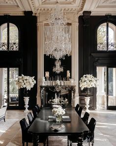 an elegant dining room with black and white decor