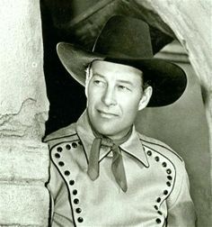 black and white photograph of a man wearing a cowboy hat