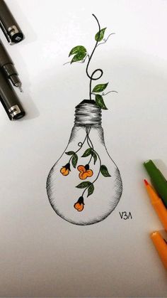 a drawing of a light bulb with flowers growing out of it and two markers next to it