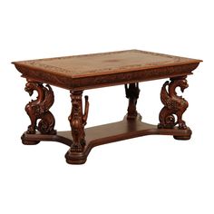 an old wooden table with carvings on the top and bottom edge, against a white background