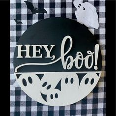 a black and white sign that says hey boo