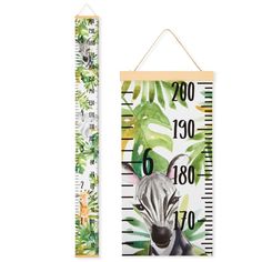 two wooden growth rulers with zebras and tropical leaves on them, one in white and the other in green