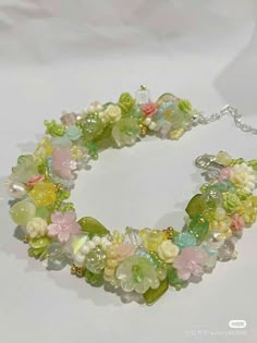 a bracelet with flowers and beads on it