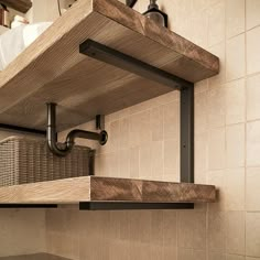 a kitchen shelf with some pipes on it