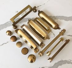 brass hardware and knobs on a marble surface