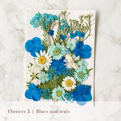 blue and white flowers on a card with the words flowers 5 1 blues and teals