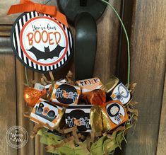 a halloween door hanger decorated with candy