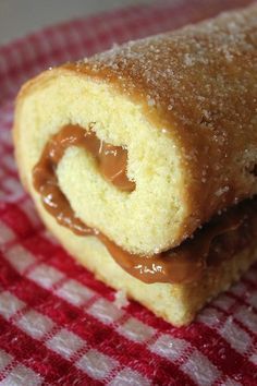 a close up of a pastry on a red and white checkered cloth