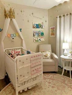 a baby's room is decorated in white and pink