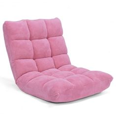 a pink futon chair sitting on top of a white floor