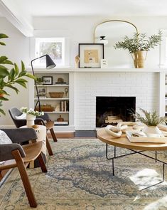 a living room filled with furniture and a fire place