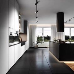 a modern kitchen with black and white decor