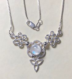 A simple and elegant sterling silver Irish inspired, Celtic Trinity Knot necklace, approximately 2 inches in diameter, and comes with an 18 inch sterling silver box chain. I'll fabricate with your choose of gemstone in the drop down menu. The gemstone size is 8mm cabochon round. It's lovely and graceful and for the Celtic, Scottish or Irish in you; it's a complete necklace! *18 Inch 1.2mm Sterling Silver Box Chain * 2 inch diameter Celtic Knot Pendant in sterling silver * 8mm round cabochon Plea Celtic Knot Necklace, Celtic Knot Pendant, Celtic Trinity Knot, Crystal Heart Pendant, Trinity Knot, Witchy Jewelry, Irish Celtic, Gifts For My Wife, Silver Box