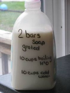 a bottle of milk sitting on top of a window sill