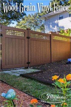 an image of a fence with flowers in the foreground