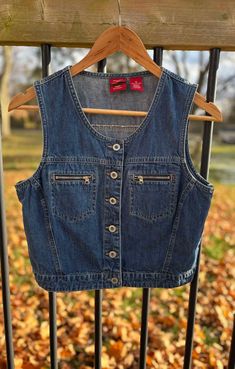 Beautiful vintage GAP denim vest.  Size Medium BUT please refer to the measurements below to ensure proper fit. Very good overall condition with no major issues found! Main button closure.  The denim is lightweight.  The tag has been damaged - please see photos.  Chest: approx. 18 inches from armpit to armpit.  Length: approx. 16 inches from neck down to hem.  Please contact us with any questions. Thanks for stopping by! Denim Vest Outfits For Women, Denim Vest Outfits, Vest Outfit Winter, Thrift Manifestation, Denim Vest Outfit, Vest Outfits For Women, Vintage Denim Vest, Vest Outfit, Jean Vest