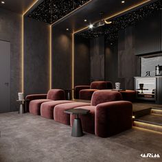 an empty room with red couches and lights on the ceiling is lit by recessed lighting