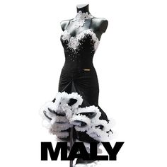 a black and white dress on display with the words maly in front of it