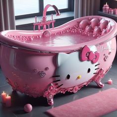 a hello kitty bath tub with candles on the floor