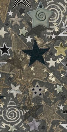 many stars and swirls are on the ground in this artistic photo with black, white, and gold colors