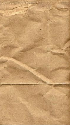 an old piece of brown paper with lines drawn on it