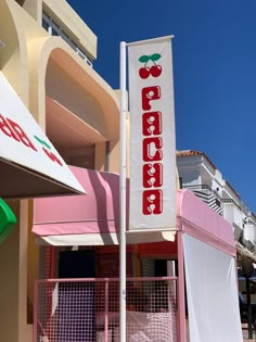 a sign on the side of a building that says peaches in red and white