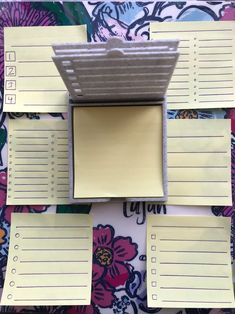 several pieces of lined paper on top of each other with sticky notes attached to them