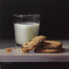 a glass of milk and two cookies on a table next to a painting of chocolate chip cookies