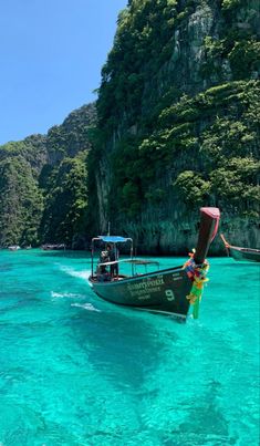 a boat is in the clear blue water