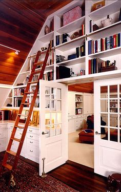 the ladder is leaning against the bookshelf in the room