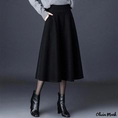 Olivia Mark - Elegant High-waisted Maxi Skirt with Flared Hem Fitted Solid Color Flared Skirt, High Waist Lined Skirt For Fall, Winter Black Wide Leg Skirt, Fitted Winter Skirt, Chic Wide Leg Winter Skirt, Winter Full Skirt Bottoms With Pockets, Winter Solid Color Pleated Maxi Skirt, Fall Wide Leg Lined Skirt Bottoms, Fall Wide Leg Lined Bottoms