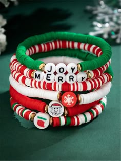 christmas themed bracelets are stacked on top of each other with the words joy merry