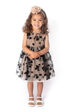 Your little fashion star will look picture-perfect in this party-ready tulle dress featuring a gauzy overlay strewn with flocked flowers. Cotton lining 100% nylon Hand wash, line dry Imported Spring Holiday Party Dress In Tulle, Spring Tulle Holiday Party Dress, Spring Festive Tulle Tutu Dress, Spring Party Tulle Holiday Dress, Spring Holiday Tulle Party Dress, Festive Sleeveless Tutu Dress Made Of Tulle, Floral Overlay, Fashion Star