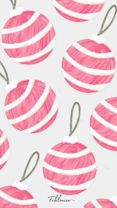 pink and white balls of yarn on a white background