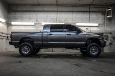 a large gray truck parked in a garage