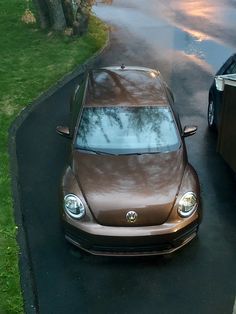 a brown car parked on the side of a road