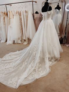 a wedding dress on display in a bridal shop