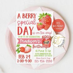 a pink plate with a strawberry birthday card on it