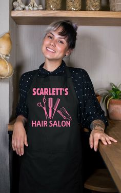 a woman standing in front of a counter with scissors