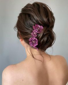 Low Bun with Flowers: A Romantic Hairstyle for Any Occasion Bun Hairstyles For Long Hair Indian, Messy Bun With Flowers Indian, Low Bun With Gajra, Low Bun Wedding Hair Indian, Messy Bun For Wedding Indian, Wedding Hairstyles Hair Up, Hairstyles For Curly Hair For Wedding, Hair Do With Flowers, Bun With Flowers Hairstyle