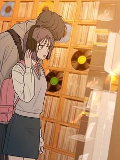 two people standing in front of a record player with headphones on and one person holding a backpack